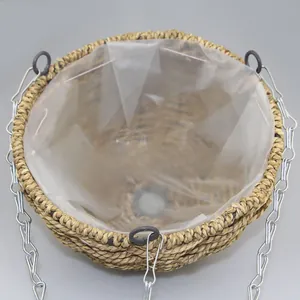 Detail of hanging wicker basket with waterproof plastic lining and sturdy metal chains