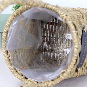 Detail view of handmade woven grass basket showing clear waterproof plastic lining inside
