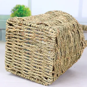 Detailed close-up showing the natural hand-woven texture and sturdy base of the straw basket