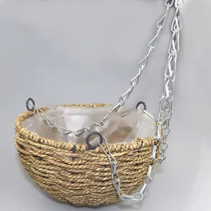Detail of hanging basket featuring hand-woven texture, metal chains, and waterproof plastic liner