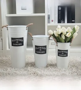 Three white vintage metal buckets with rope handles and Flowers & Garden print