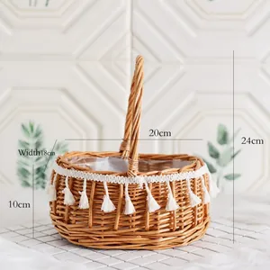 Macro shot of wicker flower basket with white cotton tassels and size 18x10x24cm