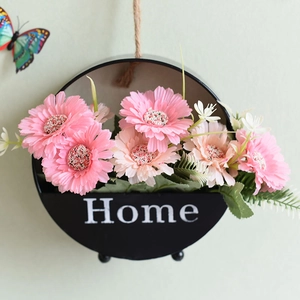Nordic wall hanging wooden flower basket with pink daisies and Home text on black pot