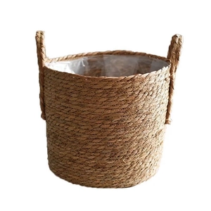 Handwoven natural seagrass basket with double handles and waterproof plastic liner