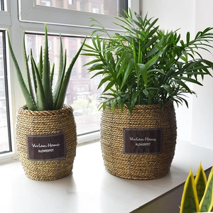 Handwoven straw planters in natural tones with leather labels for home balcony decor