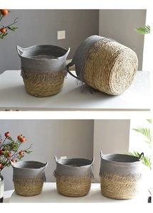 Detail of woven seagrass and cotton rope baskets with tassels in a modern home setting