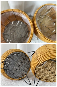 Detail of woven flower pots with black metal tripod stands and waterproof liners