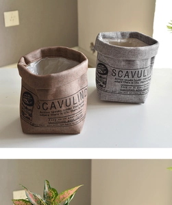 Close-up of washable fabric plant bags with waterproof lining in brown and grey