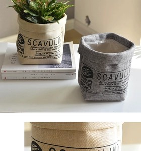Detail view of waterproof canvas planter bags with vintage text in white and gray colors
