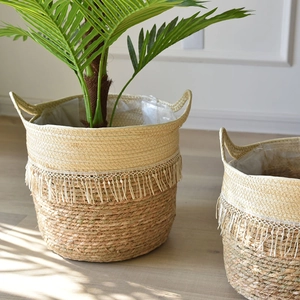 Large bohemian woven seagrass planter with cotton stitching and white tassel fringe