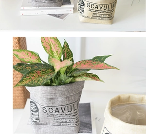 Detail of Nordic washable fabric plant pot covers in grey and beige cotton linen