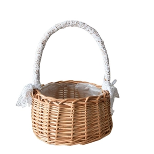 Handwoven flower basket with natural wicker, white lace trim and decorative ribbon bows