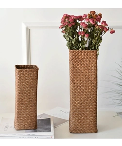 Macro view of woven plant fiber texture on rectangular handmade dried flower vases