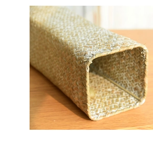 Detail of hand-woven rectangular seagrass storage box with natural plant fiber texture