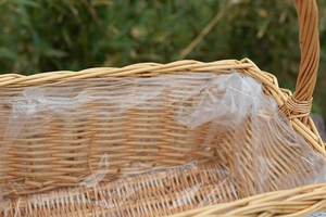 Detailed close-up of handmade wicker basket with a leakproof plastic liner for floral use