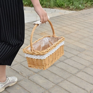 Close-up of rectangular wicker basket with white lace trim and leak-proof plastic liner