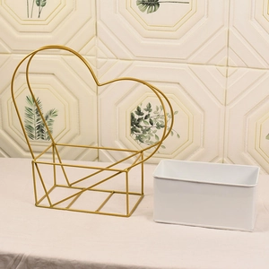 Golden heart-shaped iron flower basket with a removable white rectangular inner bucket