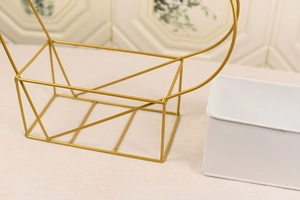 Detailed macro view of the welding on the golden geometric heart flower basket frame