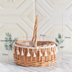 Handmade wicker flower basket with white tassels and waterproof liner for weddings