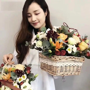 Handwoven flower basket with lace trim and fresh floral arrangement for home decor