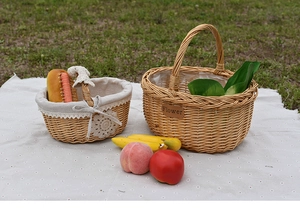 Detail of woven willow picnic basket with lace lining and flower leather patch