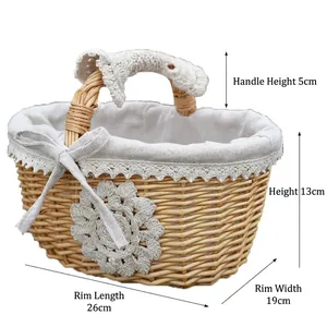 Handwoven willow basket with white lace liner and flower decor on white background
