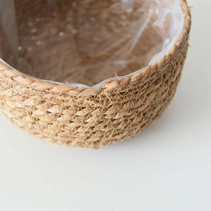 Set of two round handmade seagrass planters with waterproof liners for indoor plants