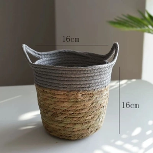 Detailed view of handmade dual-tone woven basket with cotton rope and natural fiber