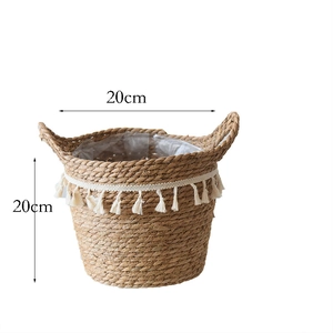 Detail of handwoven seagrass flower basket with white tassel fringe and waterproof lining