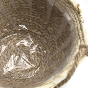 Close-up of woven hanging planter showing natural texture and waterproof plastic lining