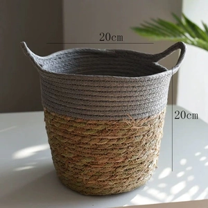Detail view of woven two-tone basket with handles measuring 20cm in height and diameter