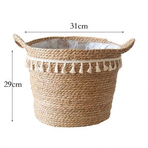 Detail showing natural rattan flower basket with white tassels and waterproof lining
