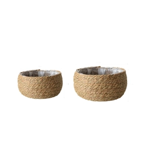 Set of two round handmade straw flower pots with plastic lining for indoor plants