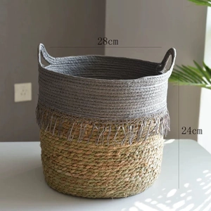 Detail view of woven storage basket with cotton tassels and fiber base, 28x24cm size