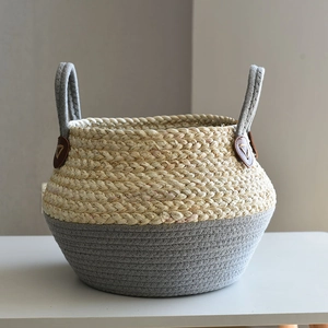 Handwoven straw and cotton rope storage basket with grey accents and leather handles