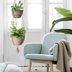 Double hanging seagrass planter basket with green plants for indoor boho home decor