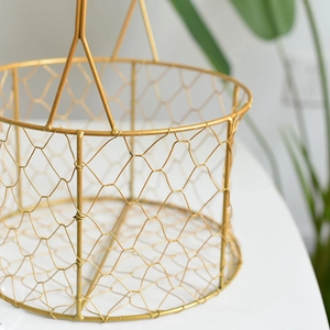 Detailed close-up of golden iron wire gift basket showing elegant honeycomb mesh texture