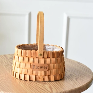 Handwoven oval wicker flower basket with waterproof lining and decorative leather label
