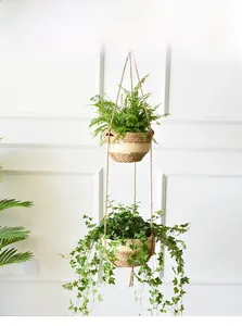Detail of two-tier hanging seagrass planters featuring natural and beige woven textures