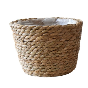 Nordic woven wicker flower pot with natural fiber texture and waterproof plastic liner