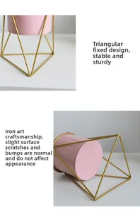 Detail view of pink metal planter with gold triangular iron stand in Nordic style