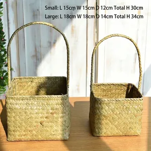 Detail of two handmade seagrass woven baskets with handles for home decor and gifts
