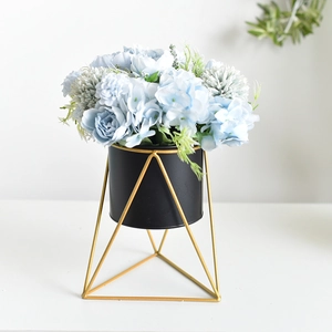Modern Nordic iron geometric stand with black planter and blue faux hydrangea bouquet