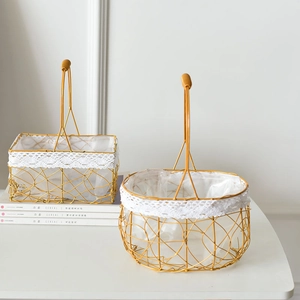 Golden metal wire woven baskets set with white lace trim and plastic liner for picnic