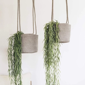 Gray cotton linen hanging basket planter for indoor plants in a minimalist Nordic style