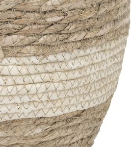 Macro detail of the handwoven natural seagrass planter with durable white stitched textures