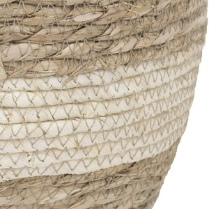 Natural seagrass woven flower pot with white horizontal stripes and handmade texture