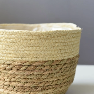 Handwoven straw plant pot with dual-tone texture and waterproof plastic liner