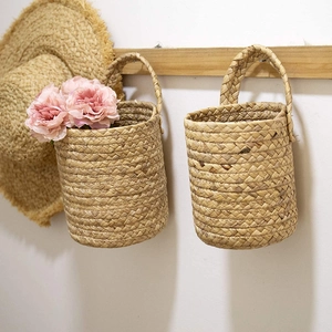 Handwoven seagrass hanging storage basket for garden plants and home organization