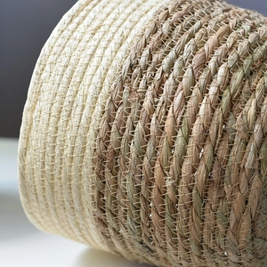 Close-up of dual-tone straw and rope woven flower pot with reinforced stitching detail